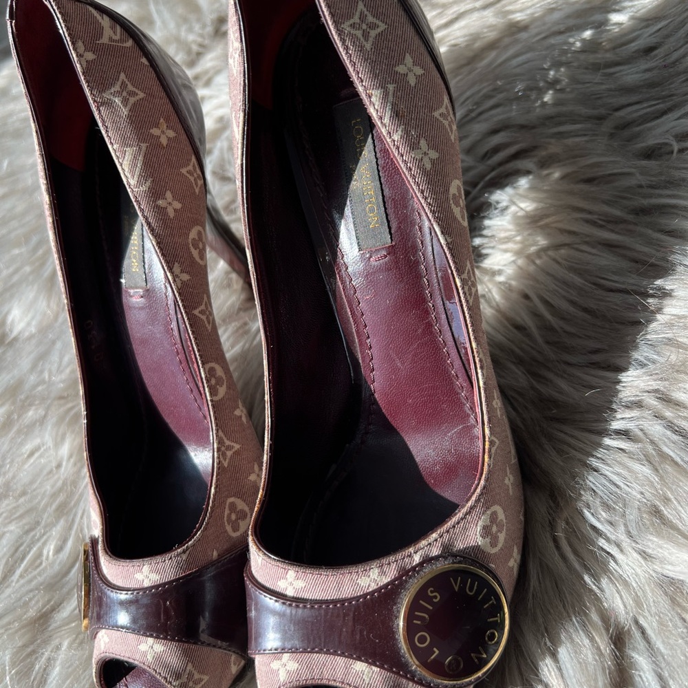 Louis Vuitton burgundy peep toe heels.
